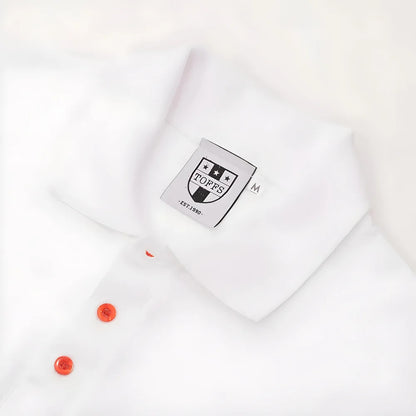 Regular Fit. Embroidered badge. Ribbed collar. Three-button placket. Short sleeves with ribbed armba_2